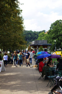 Colorful umbrellas dot Schenley Plaza’s open-air eating areas as the skies open up.